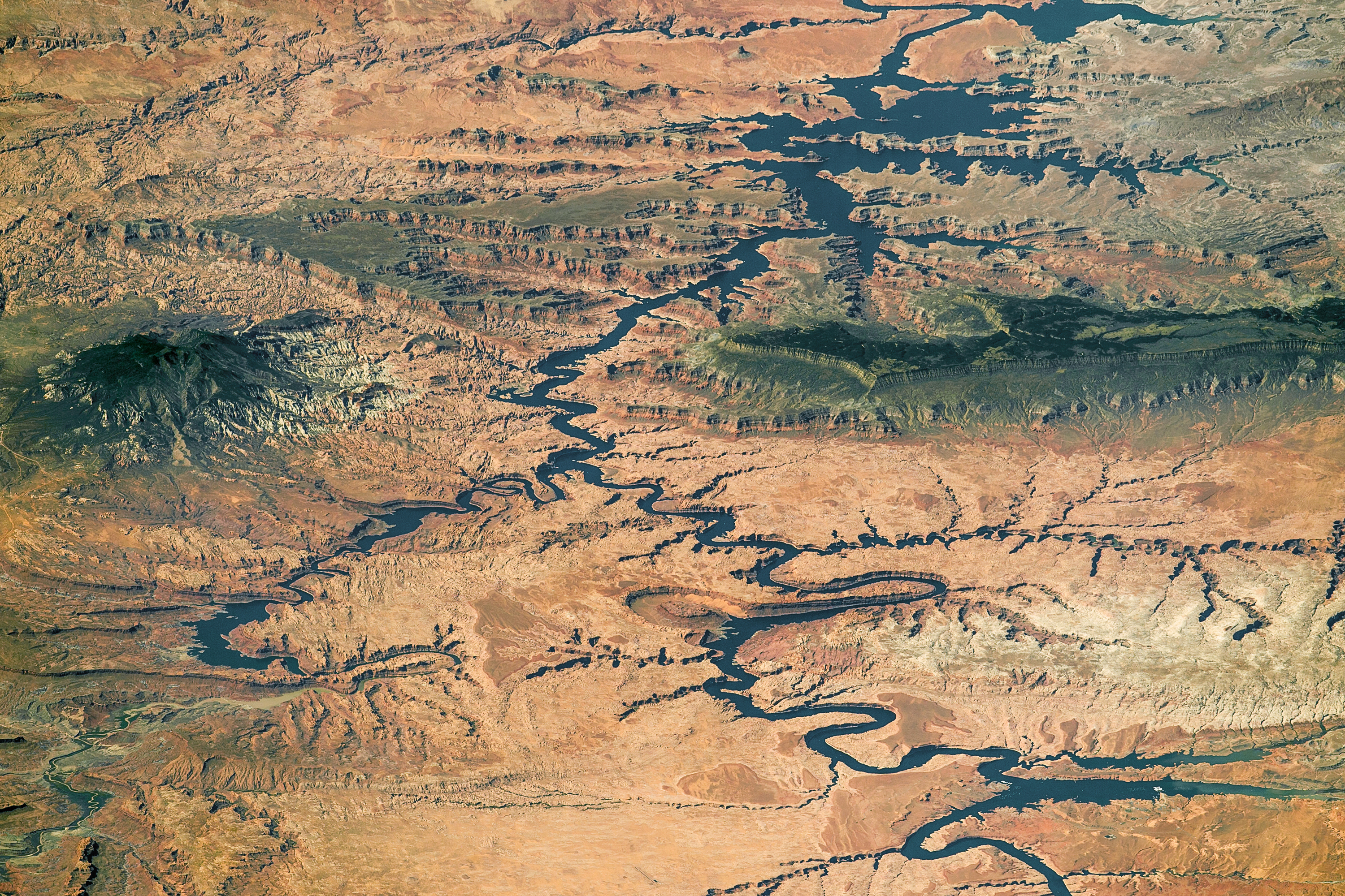 This panorama showing nearly the full length of Lake Powell in southern Utah and northern Arizona was photographed by an astronaut aboard the International Space Station, on Sept. 6, 2016. The station was north of the lake at the time, so south is at the top left of the image. (Source: NASA Earth Observatory)