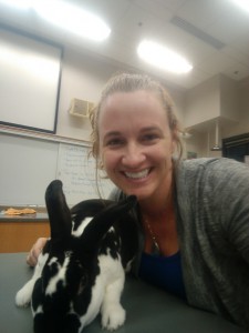 Dr. Kira Krend in her classroom with Lagomorphus Rex the Destroyer (the class bunny). Photo courtesy of Dr. Krend