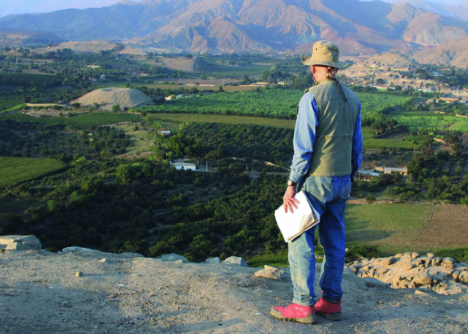 Anthropologist Robert Benfer observes El Volcán in Nepeña Valley in coastal Peru, where he and his team found evidence of solar-eclipse celebrations. (Courtesy of Robert Benfer)