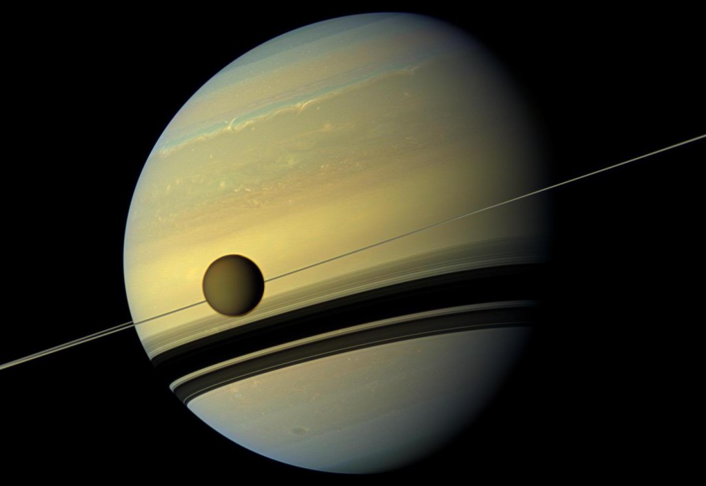 One of my favorite Cassini images, showing the razor-thin rings and hazy, carbon-rich moon Titan. It beckons to us to return. (Credit: NASA/JPL-Caltech)