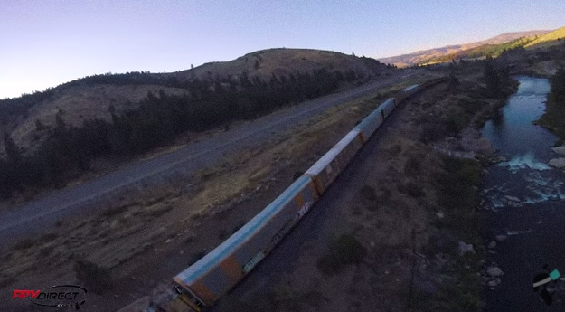 Drone Pilot Bobs and Weaves Through Moving Freight Train