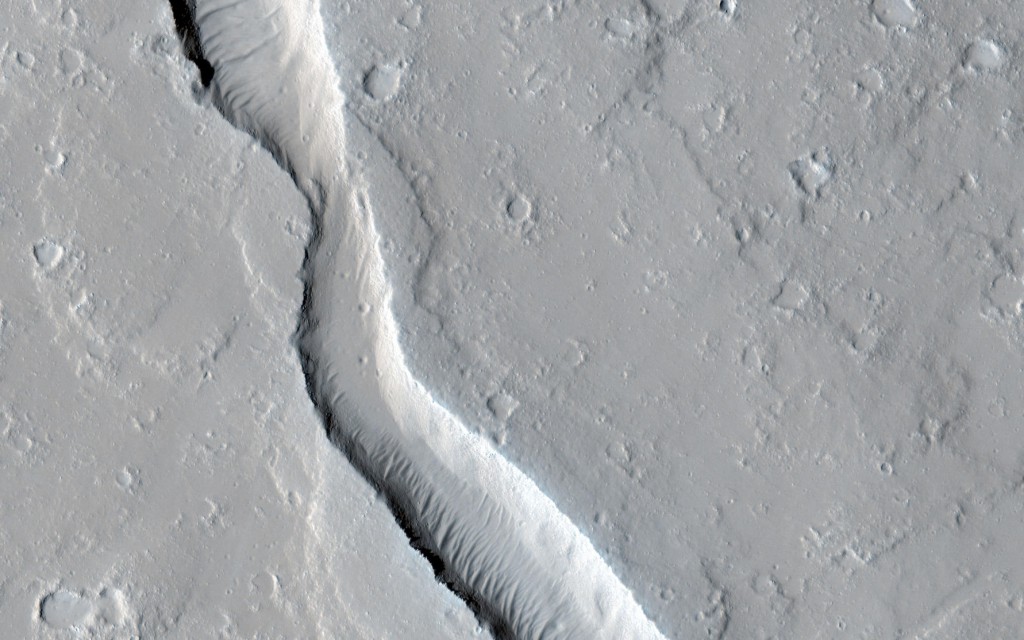 Mars Reconnaissance Orbiter HIRISE image of a collapsed lava tube from Olympus Mons. NASA