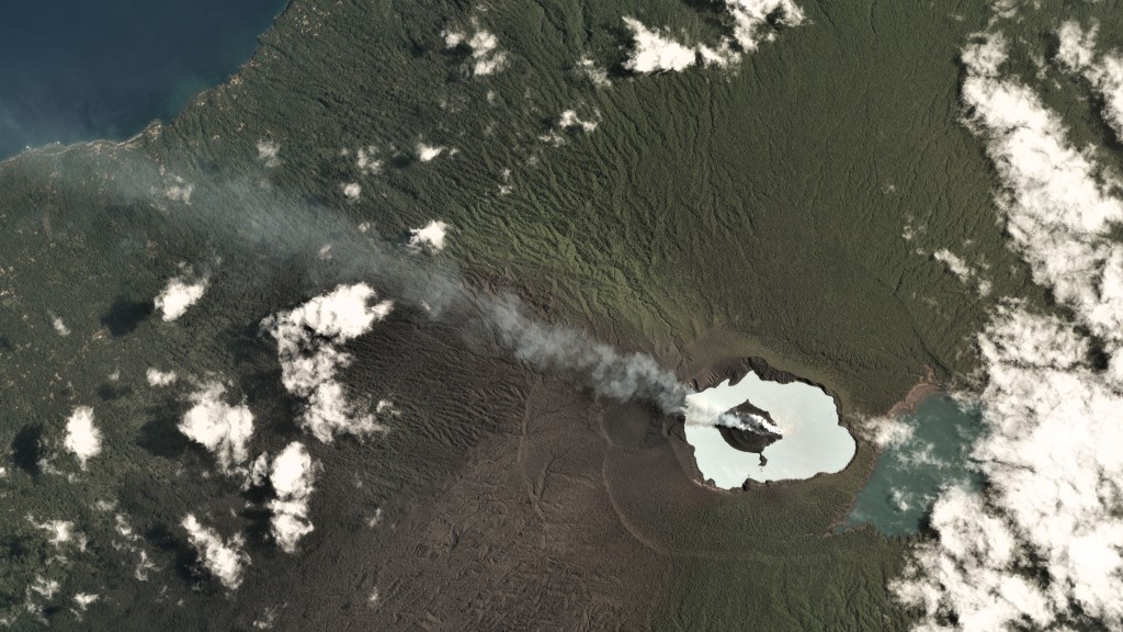 A small steam-and-gas plume from Aoba on Ambae in Vanuatu, seen on September 29, 2017. Although the eruption plume was small, the dark grey ash on the landscape betrays larger eruptions earlier in the week. Image by Planet Labs.