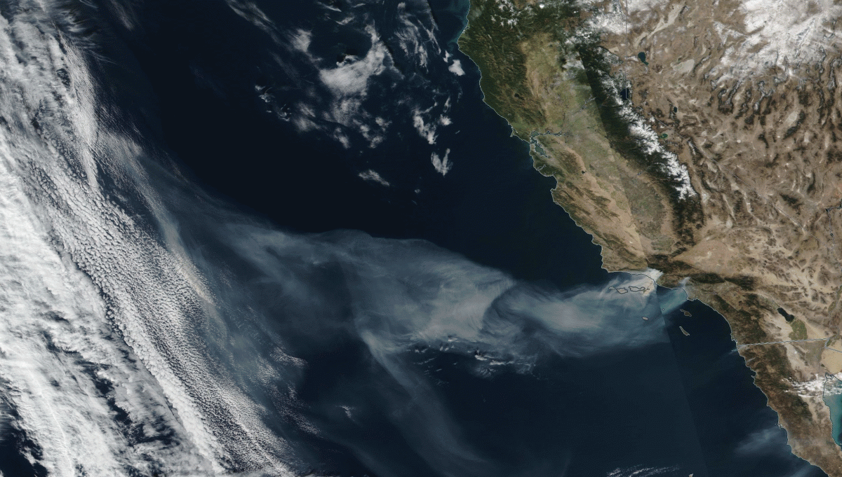 Smoke billowing from rampaging California wildfires streams across ~1,000 miles of the Pacific Ocean