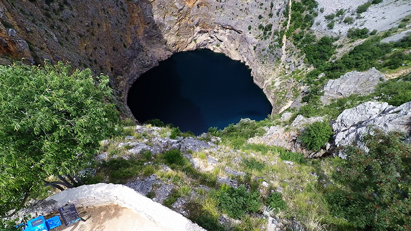 Red Lake, a sinkhole with a lake filling the bottom. Yacht Rent - Flickr.