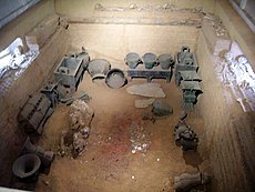 The tomb of Lady Fu Hao at Yinxu. It contained 6 dog skeletons, 16 human slave skeletons, and numerous grave goods. (Credit: Wikimedia Commons)