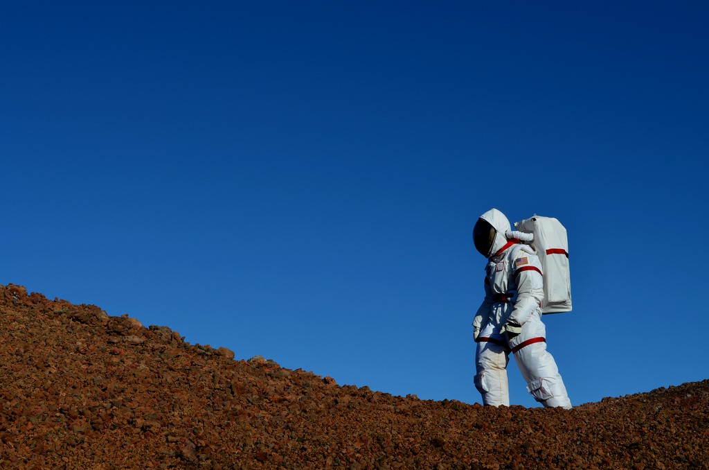 Yajaira Sierra-Sastre, a participant in the HI-SEAS Mars simulation experiment, walks across a volcanic ridge in Hawaii. (Credit: HI-SEAS/Sian Proctor)