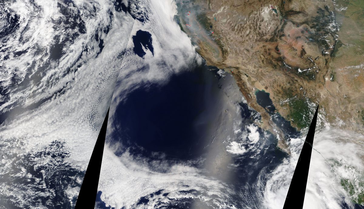 What caused this colossal heart-shaped hole in the cloud deck off the coast of California and Baja?