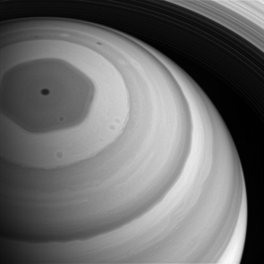 Saturn's hexagon feature towers hundreds of kilometers 